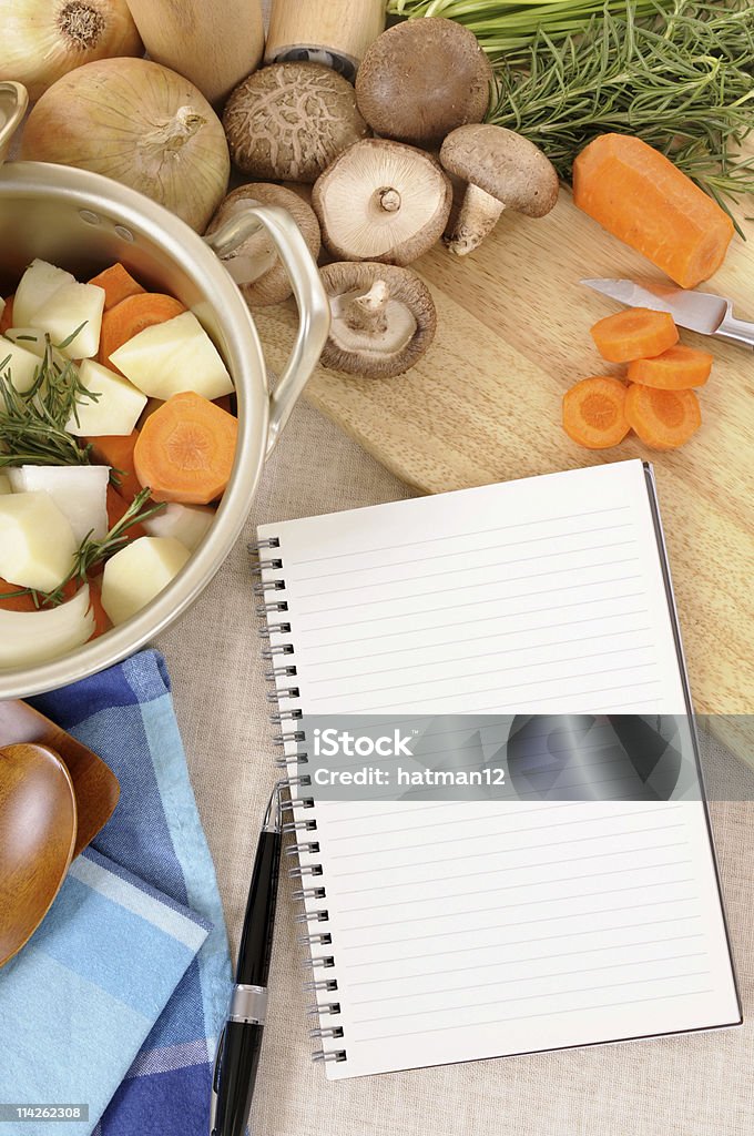 Winter vegetables with cookbook Winter vegetables and herbs being prepared for casserole, with chopping board, linen tablecloth and blank recipe book or shopping list.  To see my complete collection of blank cookbooks with a variety of different foods, please CLICK HERE.  Alternative version shown below: Backgrounds Stock Photo