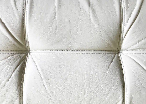 istock Beige leather texture of sofa, armchair 1142625496