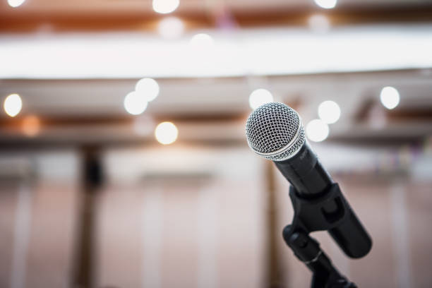 istock Seminar Conference Concept : Microphones for speech or speaking in seminar conference hall, prepare for talking lecture to audience university. Business meeting or education teaching ideas 1142625648