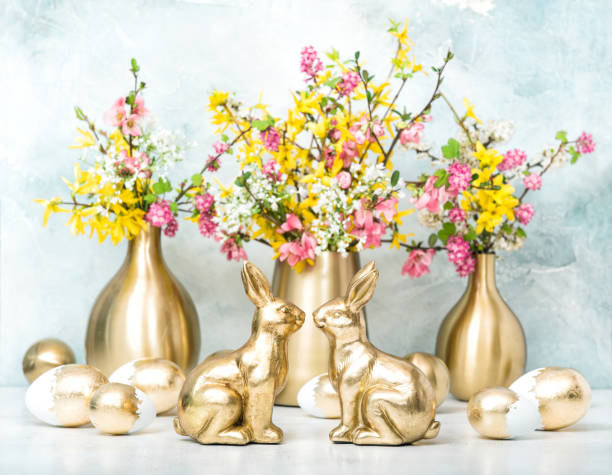 istock Easter bunny golden eggs flowers decoration 1142626403