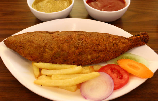 istock Fried fish served in a Bengali restaurant in India 1142628076