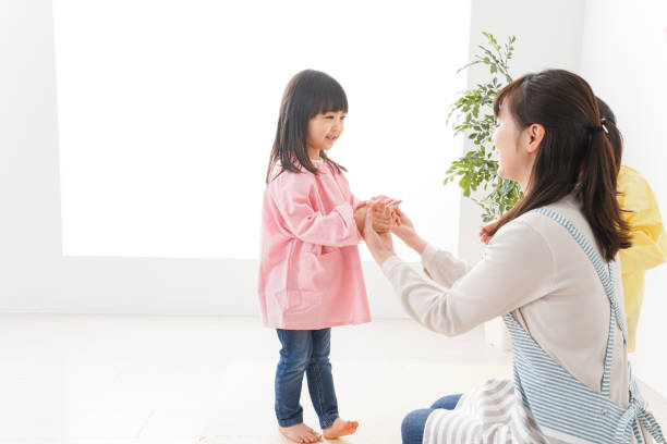 istock Children and teacher at kindergarten 1142629734