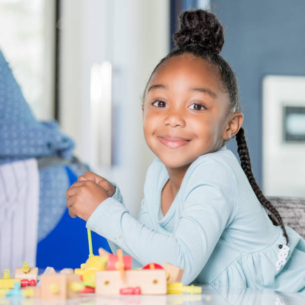 istock Young adolescent female playing with block 1142630044