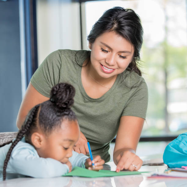 istock Nanny and young adolescent doing arts and crafts together 1142630047