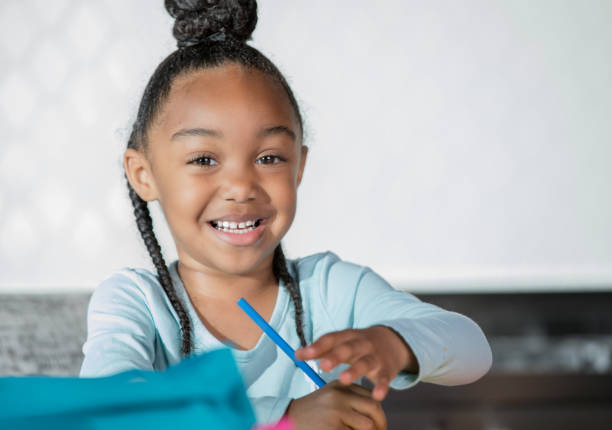 istock Young adolescent girl writing at desk 1142630065