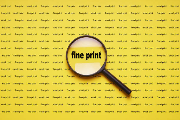 fine print enlarged with magnifying glass magnifier loupe - fine print imagens e fotografias de stock