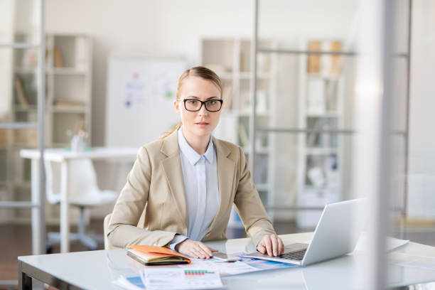 istock Puzzled businesswoman doing paperwork 1142632530