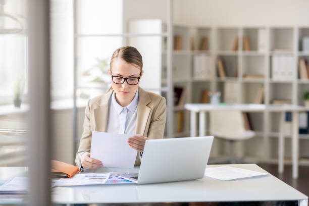 istock Lady concentrated on report 1142632531