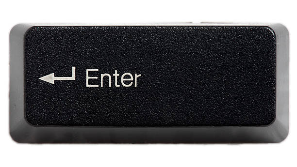 The enter key from a black keyboard Enter key from a computer keyboard. enter key photos stock pictures, royalty-free photos & images