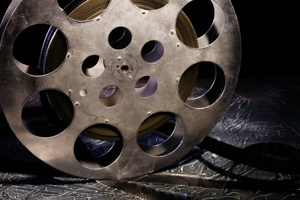 istock 35 mm film reel with dramatic lighting on a dark background 1142636201