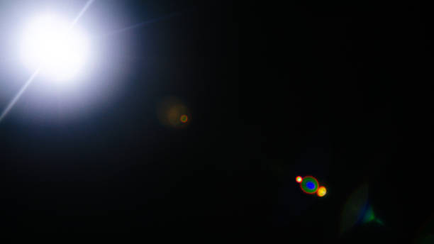 istock Abstract Natural Sun flare or Far star on the black background 1142636232