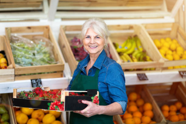 istock Senior woman working in small grocery store 1142637554