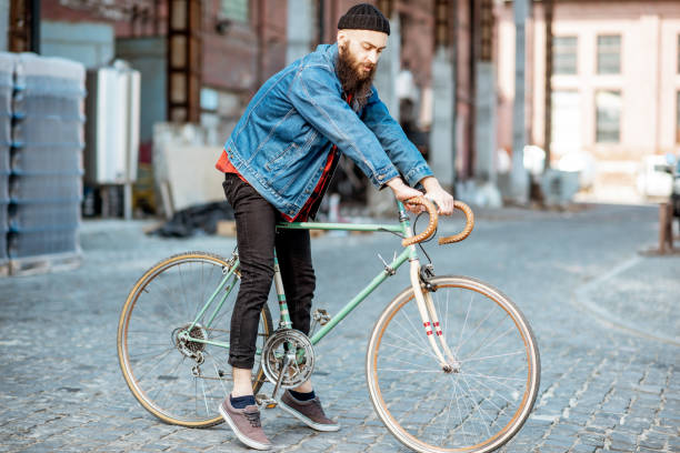 istock Stylish man with retro bicycle outdoors 1142637846
