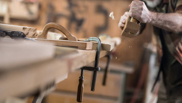 istock Senior Carpenter Working In His Old-Fashion Workshop 1142638127