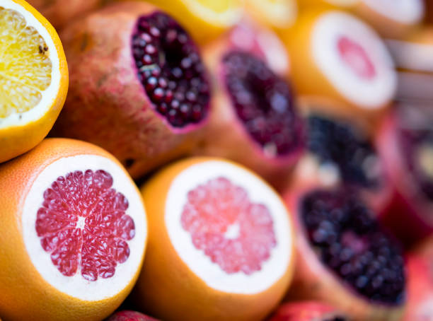 istock Oranges, Grapefruits and Pomegrenates are ready to be squeezed at market stall 1142640788