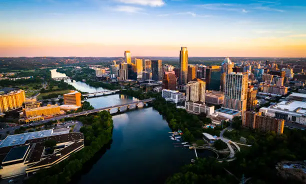 Aerial Drone view above the fastest growing city in America - Austin , Texas - The Capital City skyline under perfect colorful morning sunrise lighting - Sunrise Cityscape Skyline Austin Texas at Golden Hour Above Tranquil Lady Bird Lake 2019