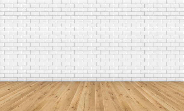 Empty room with brown wooden floor and classic white metro tiles wall. Empty loft room for design interior. Long wide picture of empty living space room. stock photo