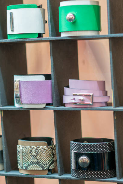 istock Many various leather and textile bracelets. Leather multi-colored bracelets in the shop. vertical photon. 1142643593
