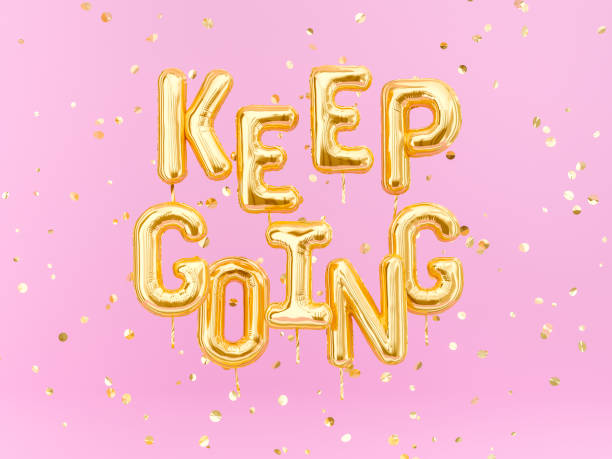 istock Keep going – motivation positive text pink and gold banner 1142643794