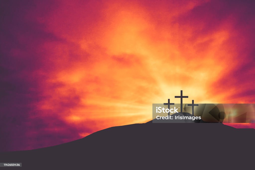 Three Christian Easter and Good Friday Holiday Crosses on Hill of Calvary with Colorful Clouds in Sky Background Three Christian Easter and Good Friday Holiday Crosses on Hill of Calvary with Colorful Clouds in Sky - Crucifixion of Jesus Christ Background Easter Stock Photo