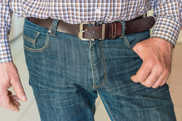 istock Men in jeans with belt close up 1142653597