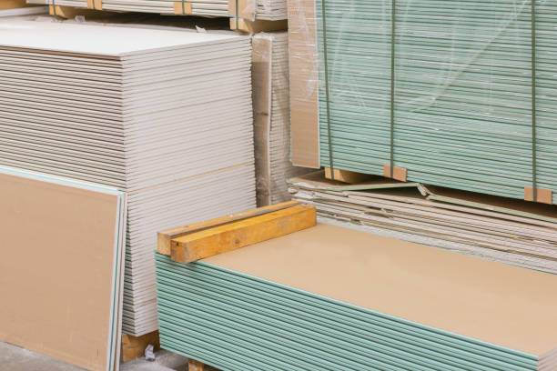 istock Gypsum plasterboard in the pack. The stack of gypsum board preparing for construction. Pallet with plasterboard in the building store. Construction Materials. Drywall warehouse 1142655443