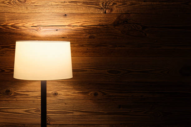 istock floor lamp against wooden wall 1142656671