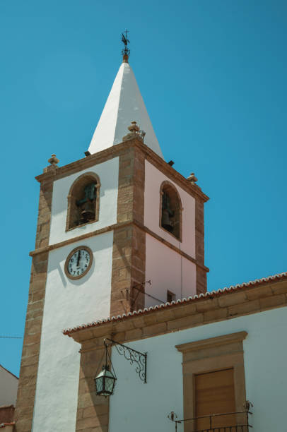 baroque style bellow tower of a church with stone decoration - castelo de vide imagens e fotografias de stock