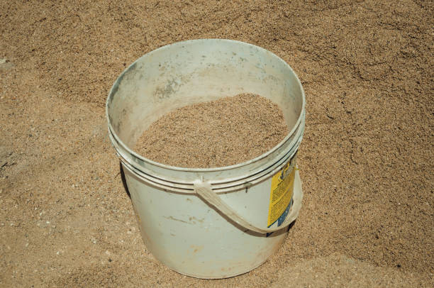 plastic bucket with sand in a construction site - castelo de vide imagens e fotografias de stock