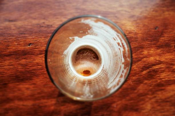 Looking to the bottom of an empty beer glass