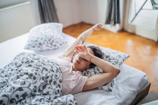istock Sleepy woman is rubbing her eye 1142659520