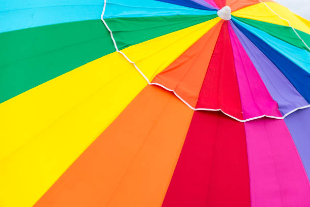Multi colored beach umbrella in Florida during summer time.