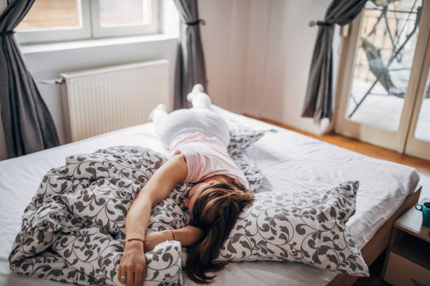 istock Young woman sleeping the bed 1142660022