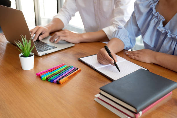 istock Group of young people learning studying lesson in library during helping teaching friend education prepare for exam, youth campus friendship teenager teens concept 1142660465