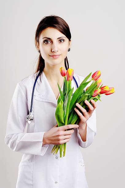 Doctor with tulips stock photo