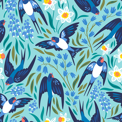 Vector seamless pattern with flying swallows and spring flowers: narcissuses, hyacinths and muscari