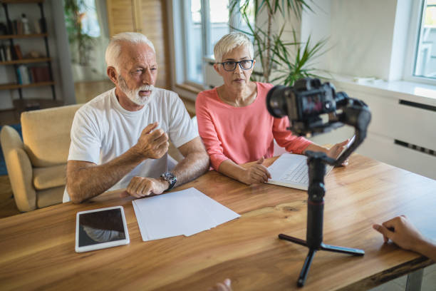 istock Elder couple recording a vlog 1142670637