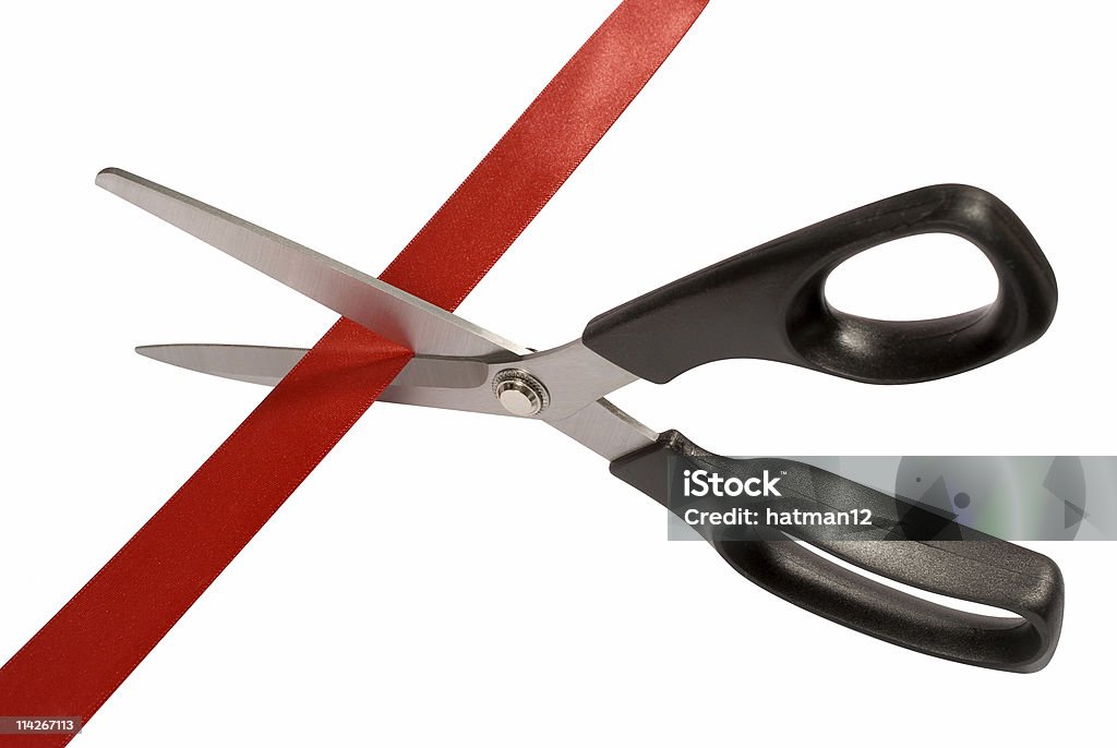 Scissors with red tape  Ribbon Cutting Stock Photo