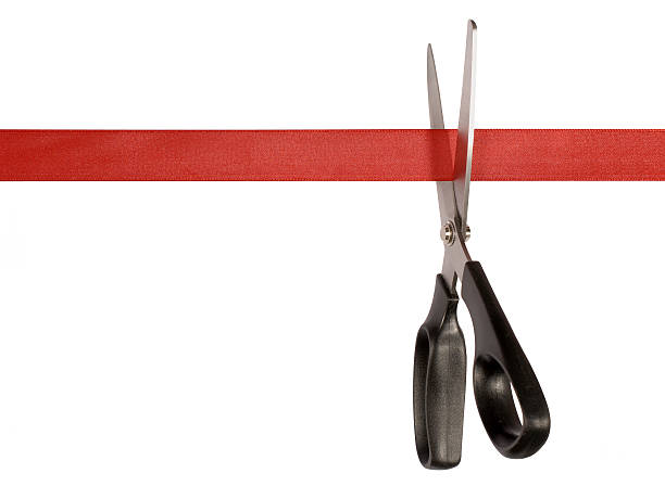 istock Scissors cutting red tape on a white background 114267114