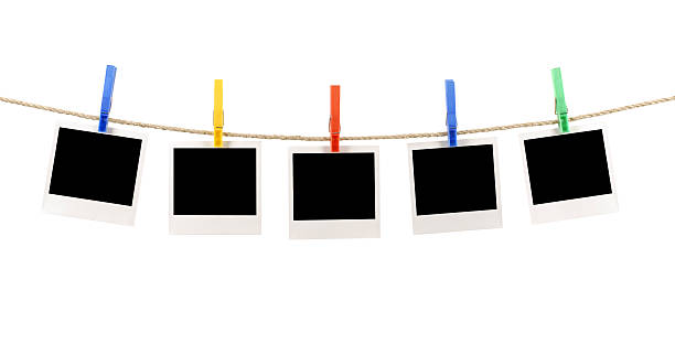 istock Blank instant photo prints on a washing line 114267117