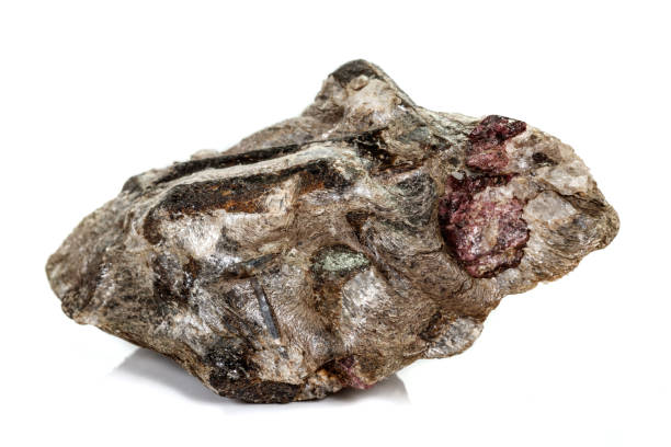 istock Macro stone Garnet mineral in rock on a white background 1142671424