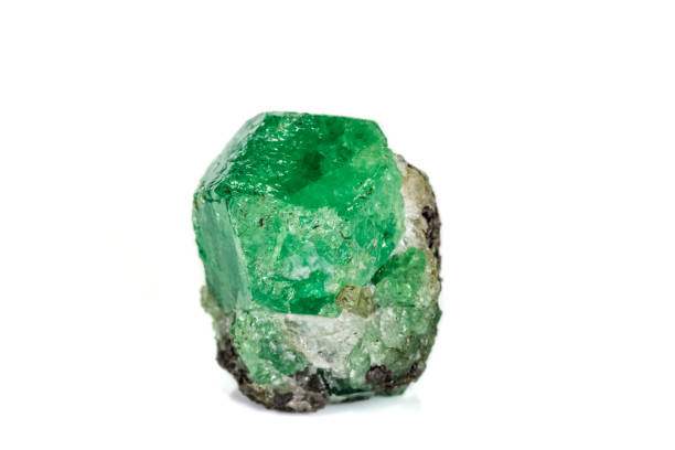 istock Macro stone garnet mineral, Uvarovite in rock on a white background 1142671472