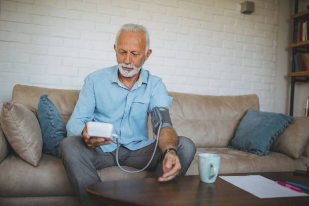 istock Senior man measuring his blood pressure 1142671644