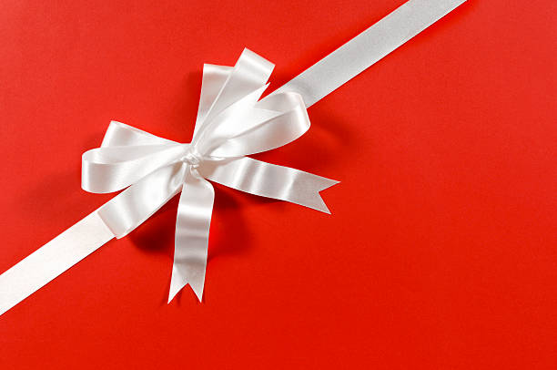 istock White gift ribbon on red paper 114267278