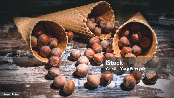 Hazelnut Nuts In Waffle Cones On A Dark Background Low Key Lighting Stock Photo - Download Image Now