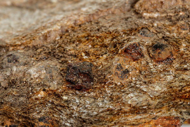 istock Macro stone Garnet mineral in rock on a white background 1142674162