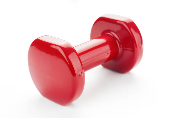 istock Red dumbbell close up on white background 1142674418