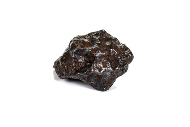 istock Macro stone mineral meteorite tektite on white background 1142674694