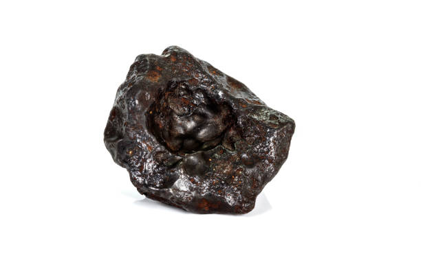 istock Macro stone mineral meteorite tektite on white background 1142674811