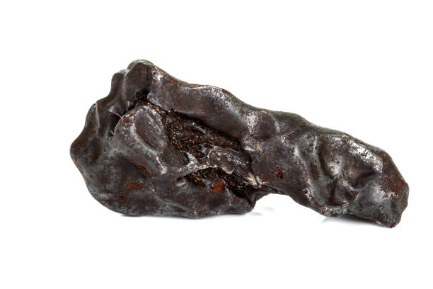 istock Macro stone mineral meteorite tektite on white background 1142674863